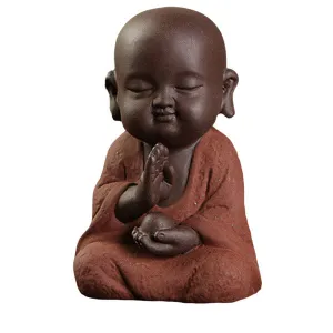 Buddha Statuette and the Monk in Red